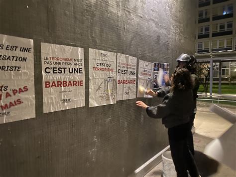 Jewish students plaster Paris walls with photos of French citizens believed held hostage by Hamas